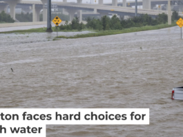 A roadside assistance vehicle is swamped by floodwaters on a Houston highway in 2024. Brandon Bell/Getty Images